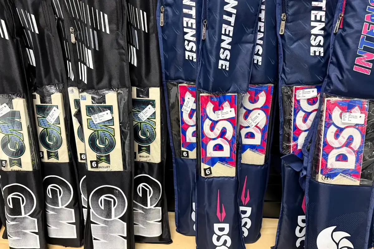Cricket bats and kit bags on the racks at the Elite Sports store