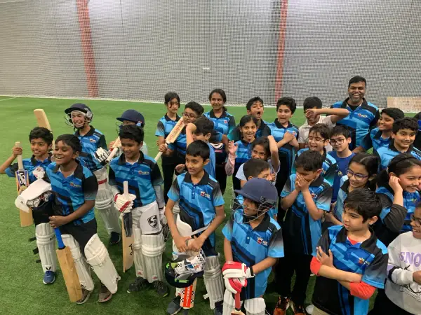 A large group of junior Elite players with their kit